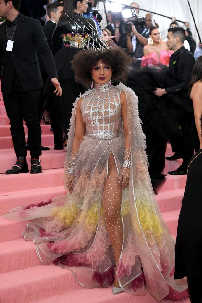 Priyanka's dress also featured a thigh-high slit underneath which the actor wore with a sheer silver polka-dotted tights.