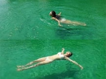 PICS & VIDEO: Mouni Roy looks stunning in a white two piece bikini as she beats the summer heat chilling in pool!