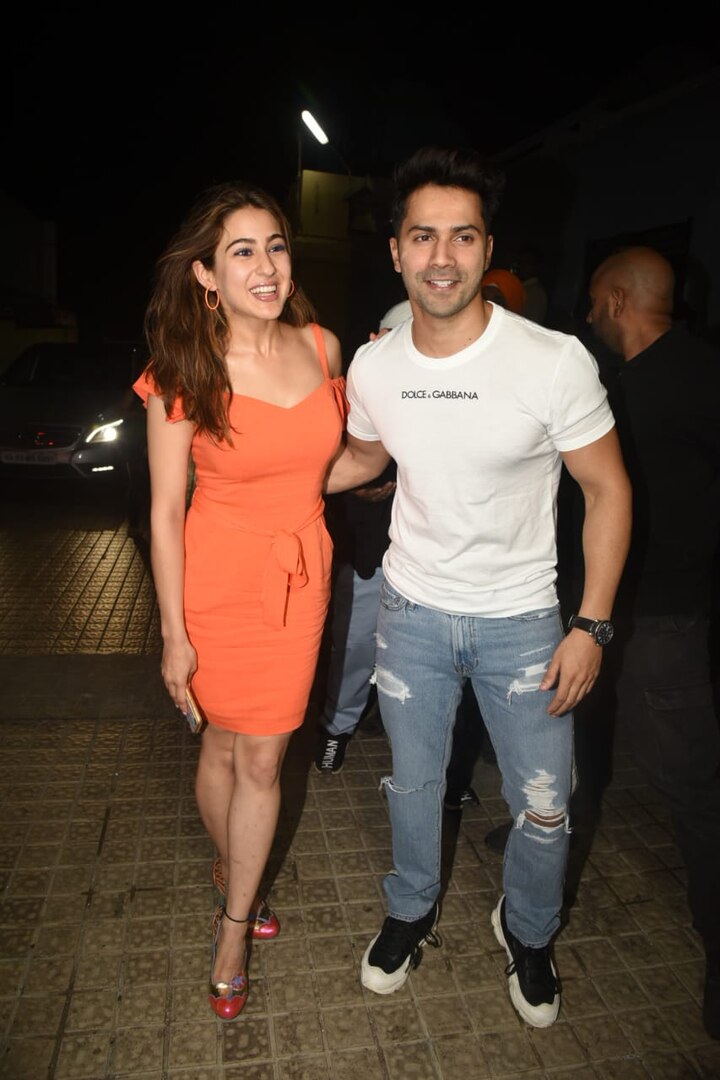 After the announcement of 'Coolie No. 1' remake, film's lead stars Sara Ali Khan & Varun Dhawan got snapped together for the first time at 'SOTY 2' screening. The duo was all smiles as they pose together for the paps. (Photo: Manav Manglani)