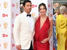 PHOTOS: Pregnant Amy Jackson cradles her baby bump in a crimson GOWN on the RED CARPET of BAFTA TV Awards 2019 while posing with billionaire fiancé
