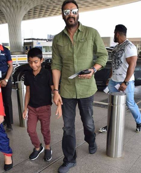 While Ajay looked dapper in an olive green shirt and denim, son Yug wore a stylish burgandy chinos and black tee.