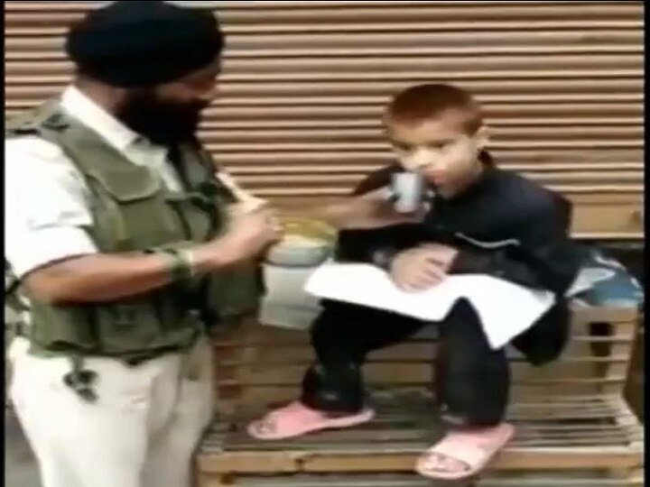Watch Video- CRPF trooper who survived Pulwama attack feeds food to child in Srinagar Watch Video: CRPF trooper who survived Pulwama attack feeds paralytic kid in Srinagar