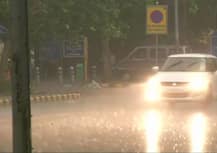 IN PICS: Heavy showers bring respite to residents from scorching heat in Delhi-NCR