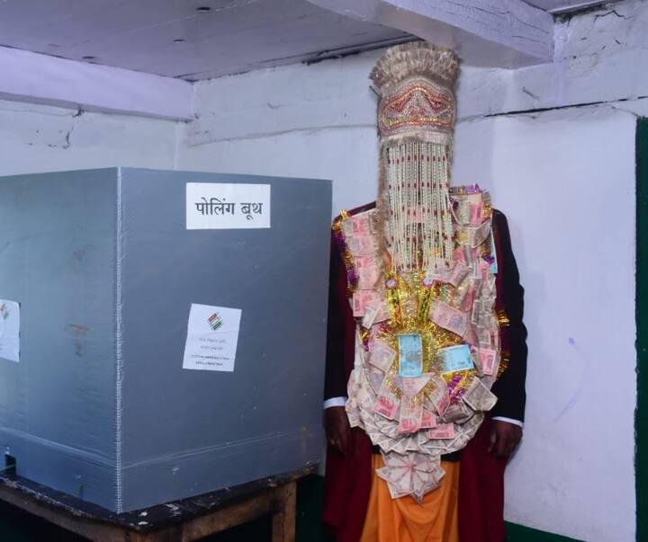 Himachal Pradesh: A bridegroom along with his family casts his vote at polling booth number 8 in Manali parliamentary constituency.
