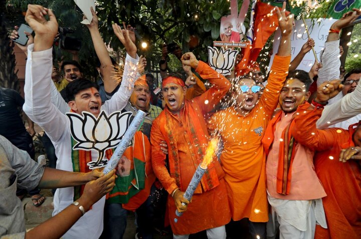 The enthusiastic workers and supporters of BJP danced to drum beats amid intense sloganeering. (Picture credit- AP)