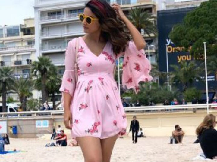 Cannes 2019: Hina Khan on Cannes beach in a short pink dress  After turning heads on the RED CARPET, Hina Khan slays it on Cannes beach in a short pink dress; SEE PICS