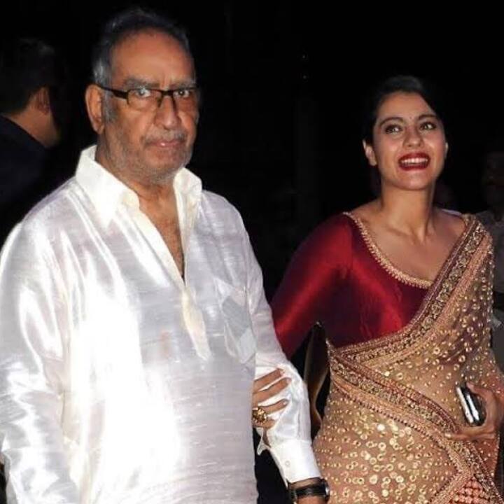 Here is one very adorable picture of Kajol with her father-in-law Veeru Devgn as she shold his hands adorably walking him at an event
