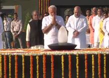 IN PICS: Prime Minister Narendra Modi pays tribute at Rajghat, War Memorial ahead of swearing-in