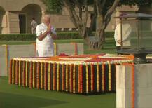 IN PICS: Prime Minister Narendra Modi pays tribute at Rajghat, War Memorial ahead of swearing-in
