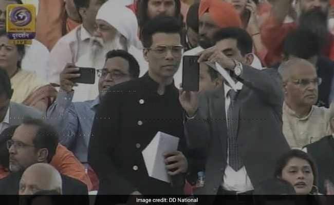 Karan Johar obliging attendees with the selfies