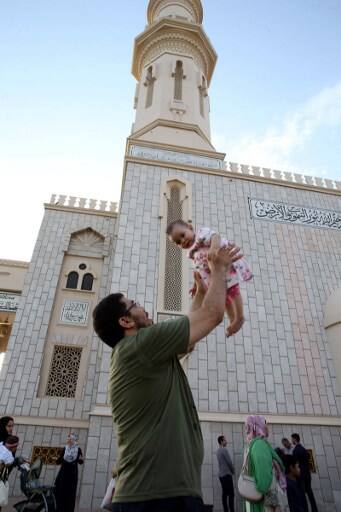 Most businesses close during Eid, as people dress up and visited relatives, enjoying their first daytime meals in a lunar month. / IMAGE: Oman (Photo by MOHAMMED MAHJOUB / AFP)