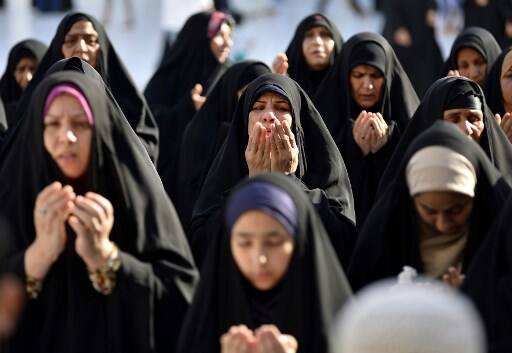 Muslim Sunni powerhouse Saudi Arabia, as well as Kuwait, Qatar and the United Arab Emirates, started celebrating on Tuesday, whereas Egypt, Syria, Jordan, the Palestinian territories and others said the Shawwal crescent moon was not visible across the country and won't start till Wednesday. IMAGE: Iraq (Photo by Haidar HAMDANI / AFP)