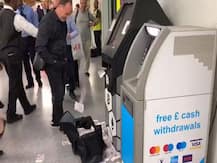Bitcoin ATM starts shooting out notes at busy station; onlookers surprised