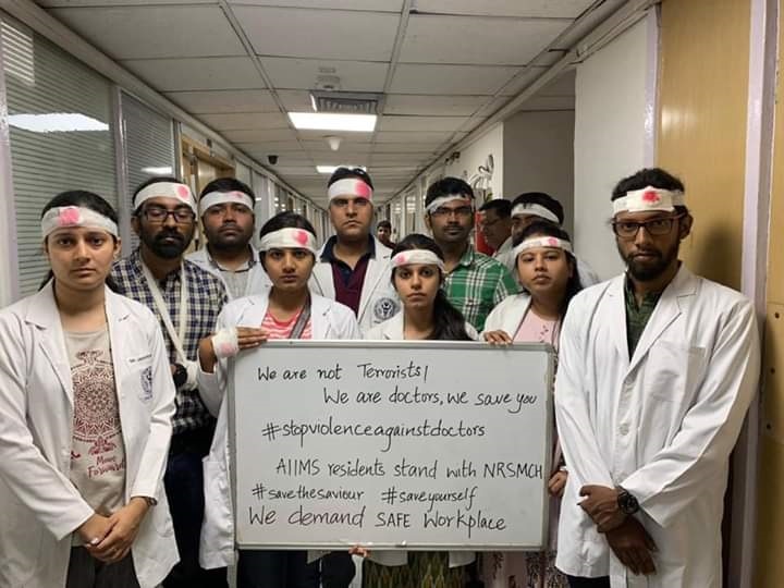 West Bengal doctors protest: AIIMS doctors wear bandages as black bands; to boycott work tomorrow Condemning violence in West Bengal, AIIMS doctors in Delhi wear bandages as black bands; to boycott work tomorrow