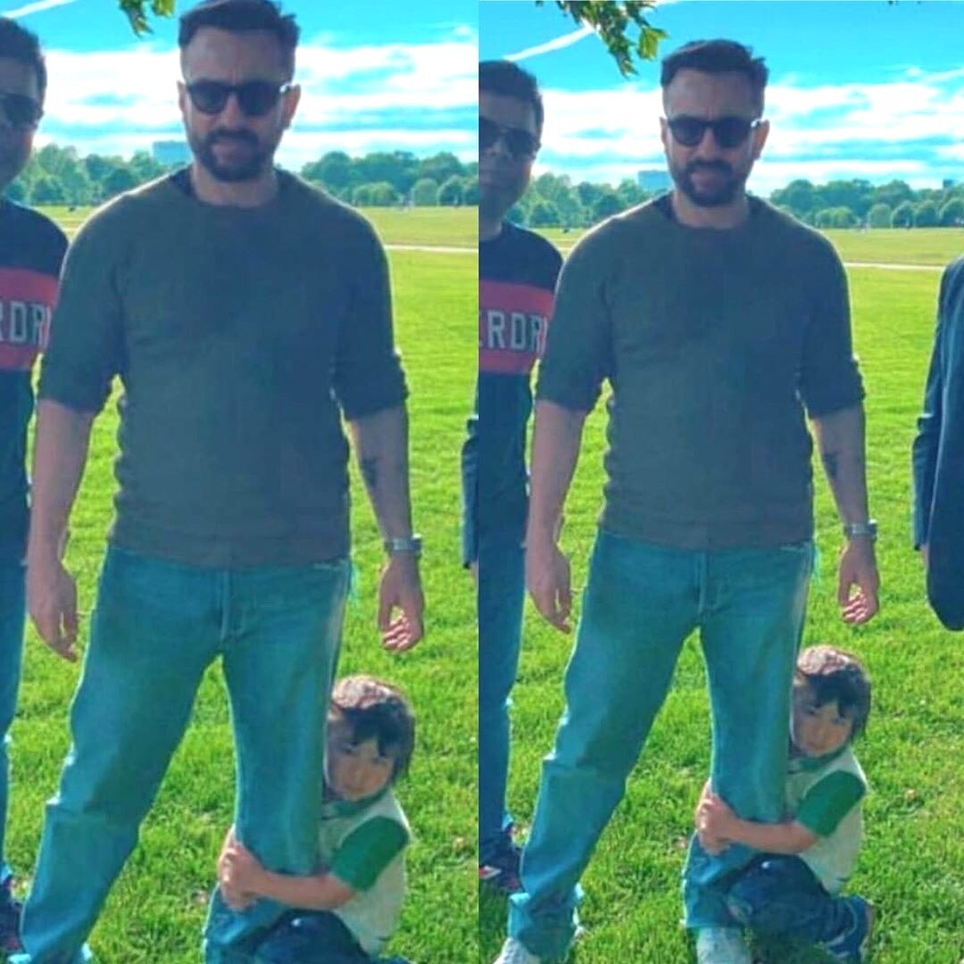 Taimur wrapped around dad Saif's legs sitting at his feet in London is the cutest thing on Internet, reminds of mom holding son in-between her legs!