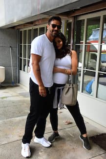 PHOTOS: Arjun Rampal & PREGNANT girlfriend Gabriella Demetriades TWIN in black & white as she flaunts her BABY BUMP on lunch date!