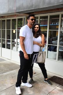 PHOTOS: Arjun Rampal & PREGNANT girlfriend Gabriella Demetriades TWIN in black & white as she flaunts her BABY BUMP on lunch date!