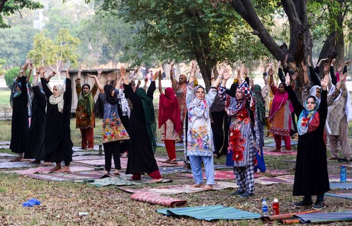 It is a proven fact that the benefits of yoga are boundless, especially in creating a healthy mind and soul. And, this has prompted Pakistanis also to stretch and breathe in order to cultivate healthy bodies and minds. On the fifth International Yoga Day, here are some pictures from Lahore where both men and women came out in droves to embrace numerous health benefits by performing yoga. (PIC/AFP.) 