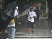 Mumbai Rains In Pictures: Water-Logged Streets, Traffic Jams, Cancelled Trains Bring City To A Halt