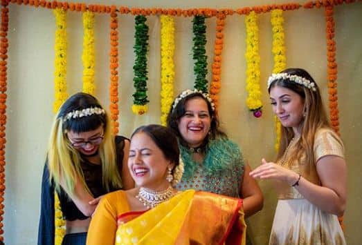 Sameera, who looked beauitful in a yellow Kanchipuram saree, was beaming with joy in her baby shower.