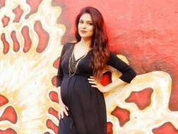 PICS: 8-Months Pregnant Neha Kaul Flaunts Baby Bump As She Looks Stunning In A Black Gown!