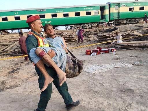 Lahore/Islamabad:At least 16 passengers were killed and more than 80 others injured on Thursday when an express train rammed into a stationery freight train in Pakistan's Punjab province, officials said. (Photo by STR / AFP)