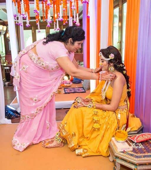 Charu's mother Neelam Asopa applying haldi to her beautiful daughter
