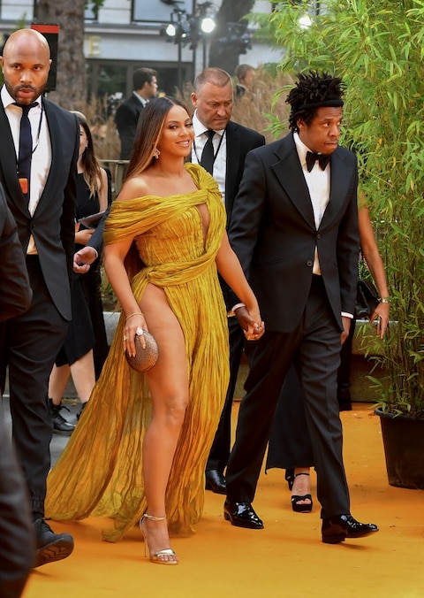 Beyoncé Knowles Makes A Daring Yellow Carpet Appearance In A Gold Gown With A VERY Revealing