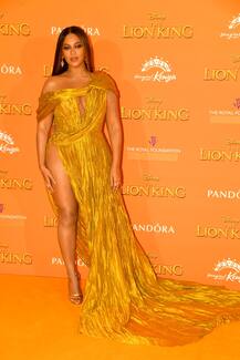 PHOTOS: POP QUEEN Beyoncé Knowles Makes A Daring Yellow Carpet Appearance In A Gold Gown With A VERY Revealing Thigh-High Slit At London\'s Premiere Of The Lion King!