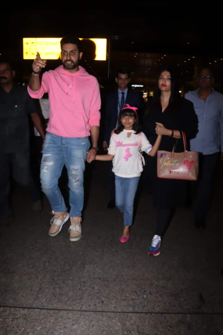 Abhishek looked handsome in a pink hoodie paired up with blue denims and light brown shoes.