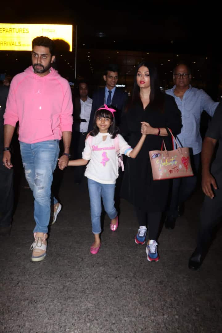 On the other hand, Aishwarya looked at her beautiful self in an all black outfit teamed up with a pair of blue and red shoes. Little Aaradhya looked adorable in a white tee, blue denims and pink shoes.