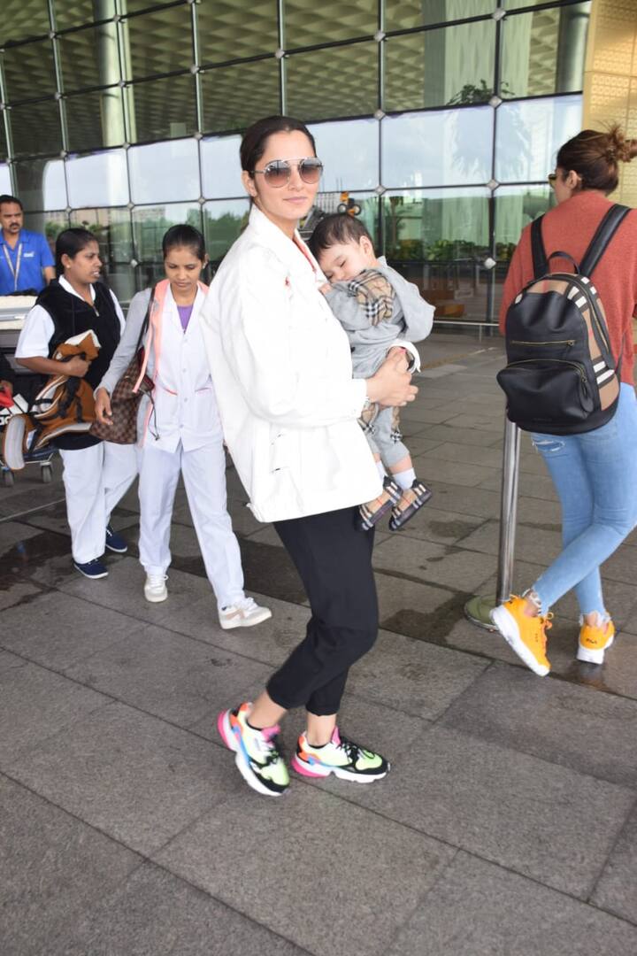Sania made sure to smile for the paps while her little baby was sleeping in her arms 