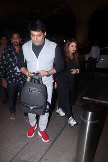 PHOTOS: Kapil Sharma\'s Wife Ginni Chatrath FLAUNTS BABY BUMP & PREGNANCY GLOW At The Airport As The Couple Leave For Their Baby-moon!