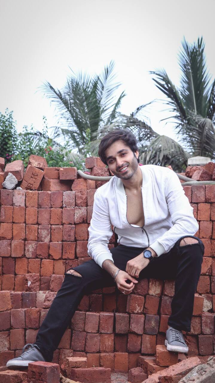 While in a couple of candid frames, Ankit looks absolutely stunning in a totally contrasting white jacket, black trousers, and sneaker, in some others, the actor donned a light blue full sleeve shirt with jeans in the most perfect way. 