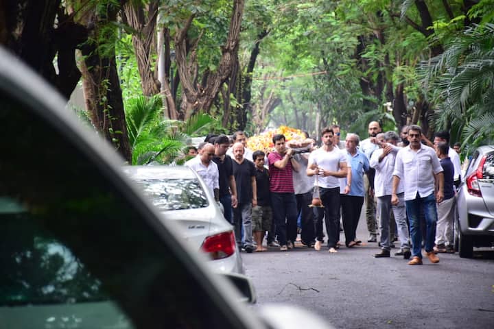 The grieving family was clicked by the paparazzi on way to the crematorium 