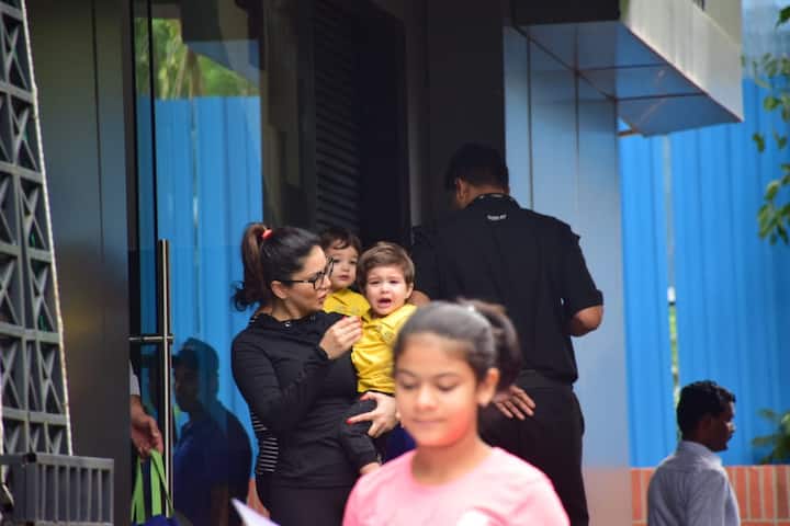 The actress was carrying on of her son who was sobbing for some reason while the other baby was nestled in his nanny's arms and was calm as he gazed at the paparazzi.