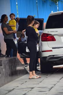 PHOTOS:Yummy-Mummy Sunny Leone Tries To Calm Down Her Crying BABY SON Post Play School!