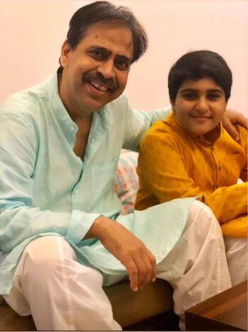 Shoaib's father posing with his younger brother.