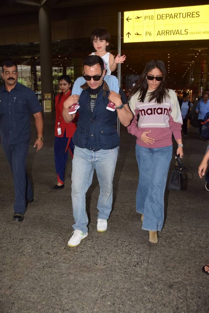 The lil munchkin was wearing a white vest, blue denim and red sneakers 