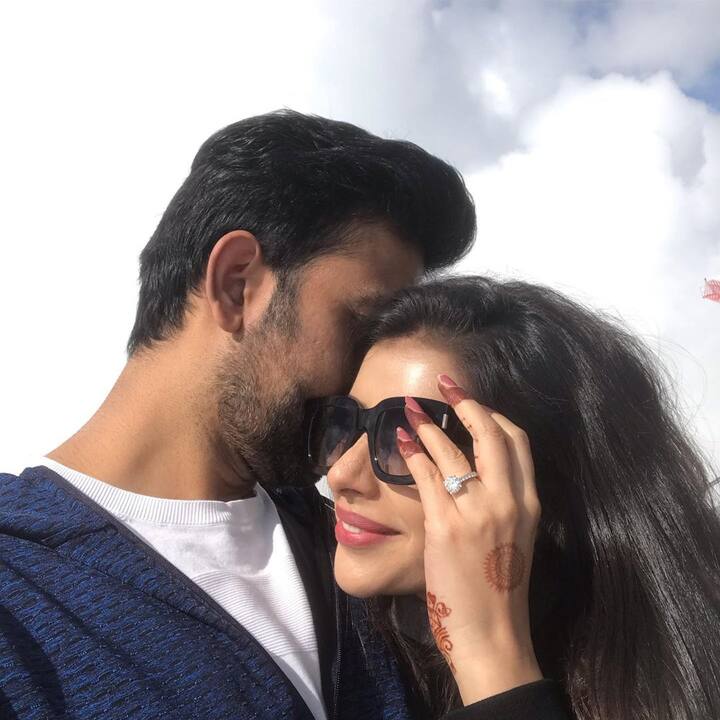 ‘’Romancing the Swiss mountains ???? with a passionate kiss ???? #honeymoon #paradise #ilovemywife #myworld,’’ Rajeev captioned the picture.