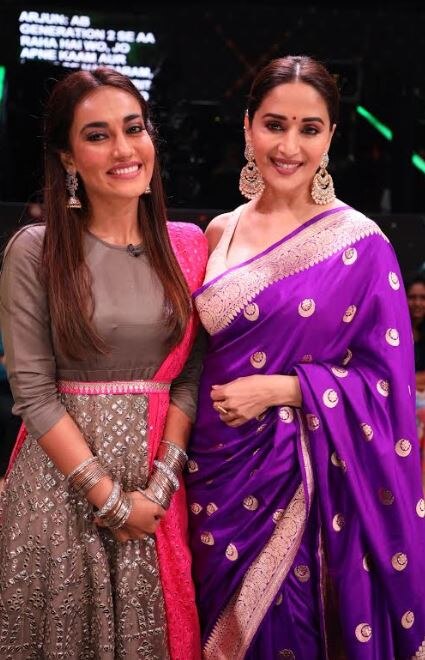 Madhuri Dixit flaunted her million dollar smile as posed along with Surbhi Jyoti.