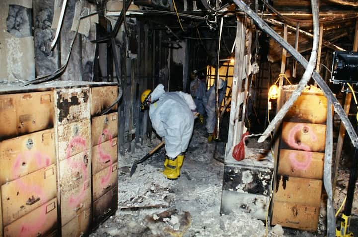 FBI agents working at the Pentagon after the crash of American Airlines Flight 77 on September 11, 2001. - (Photo by HO / FBI / AFP)