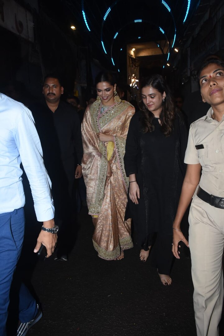The actress wore a stunning peach heavy Sabyasachi saree and paired it with traditional earrings. She completed her look with hair tied in a bun and with minimal makeup.