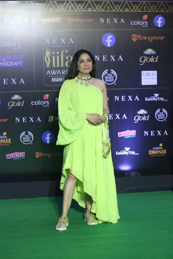 The 6o-year-old actress, turned heads after a picture of her donning a neon asymmetrical dress with golden sneaker was shared by her daughter, designer Masaba Gupta.