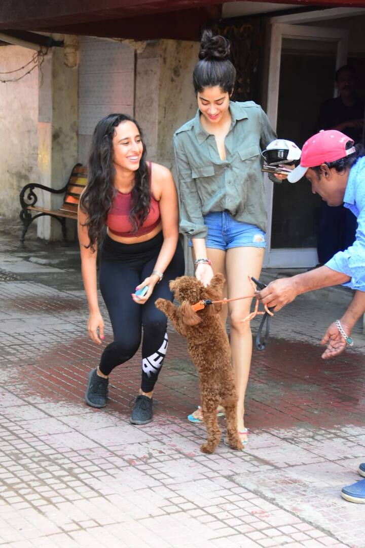 Janhvi was seen in a olive green shirt and denim shorts.