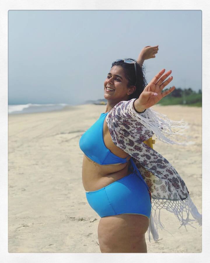 Here's the latest picture Rytasha shared, donning a blue bikini on the beach and with a message of 'body positivity'