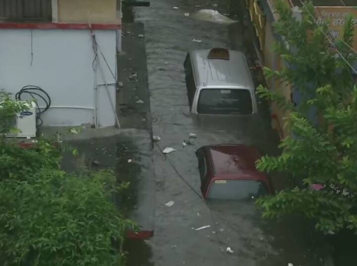 Vehicles have submerged in waist-deep water. (ANI Photo)