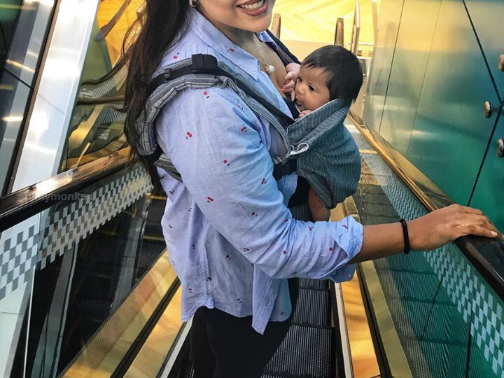 Sameera Reddy shared pic carrying newborn daughter Nyra Varde at a mall on International Babywearing Week! Sameera Reddy Goes Shopping In A Mall With Newborn Daughter Nyra Varde, Poses On The Escalator Sharing Message For International Babywearing Week!