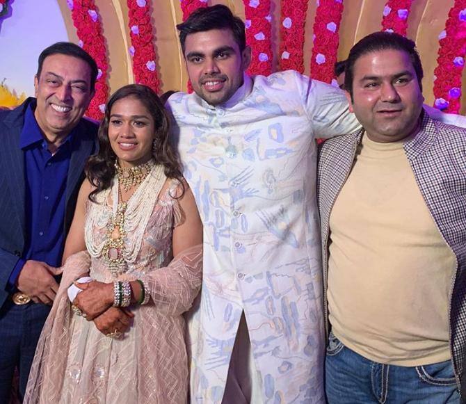 After the marriage ceremony, the wedding reception of Babita-Vivek took place in Haryana. Here's a picture of former 'Bigg Boss' winner & actor Vindu Dara Singh posing with newlyweds at their reception.  (Photo: Instagram)