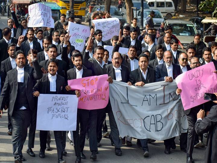 Advocates hold placards and shout slogans during a protest aganist NRC and Citizenship (Amendment) Act, in Prayagraj. (Image: PTI